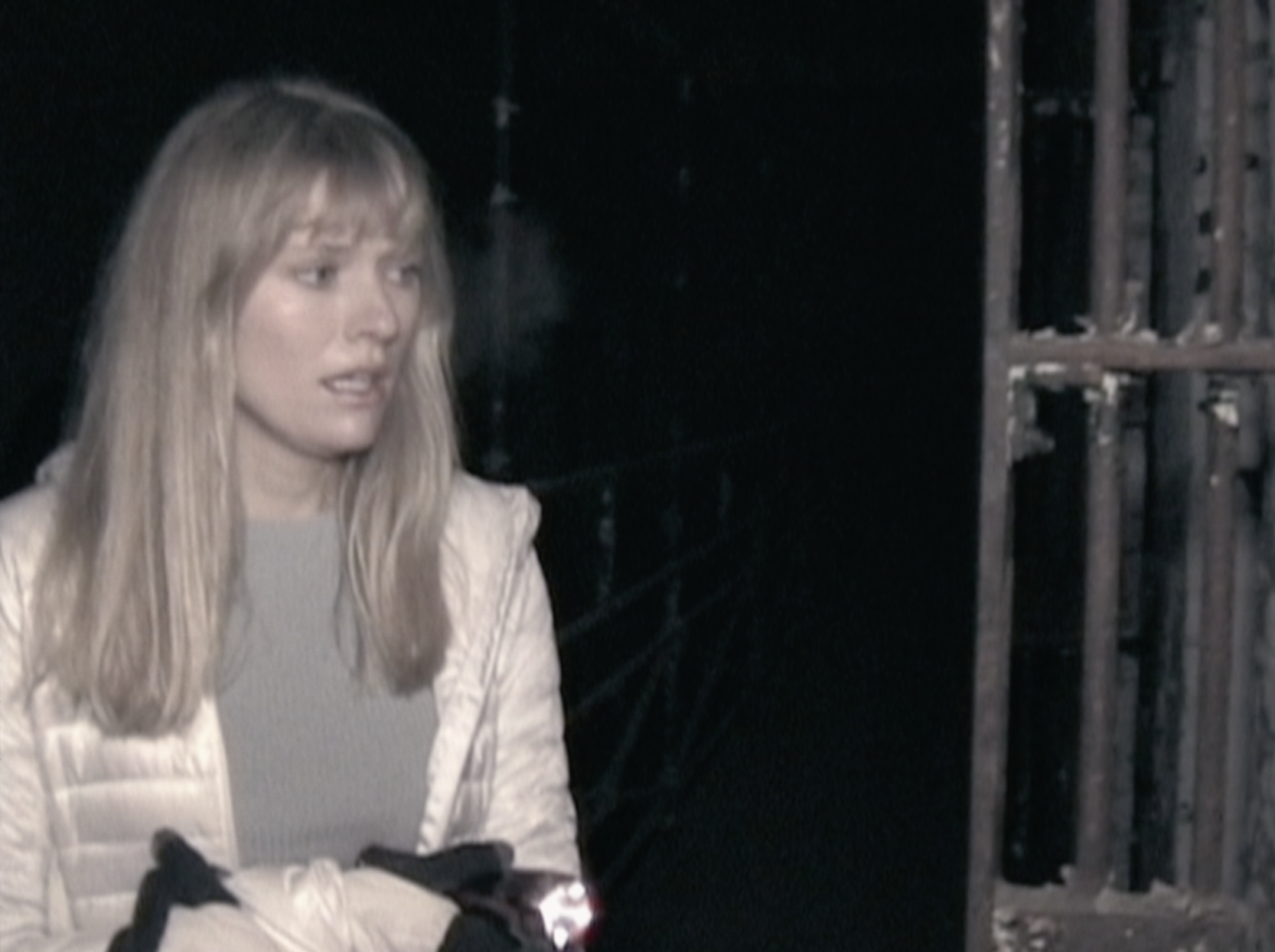 Riley in prison setting looking cold